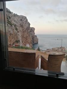 a view of the ocean from the balcony of a house at Belyounech studio location de vacance in Tétouan