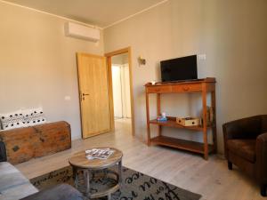 TV a/nebo společenská místnost v ubytování B&B Benvenuto