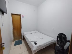 Uma cama ou camas num quarto em Hotel Oliveira 44