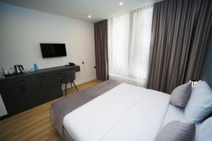 Voodi või voodid majutusasutuse B&M Hotel toas