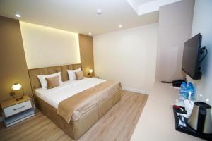 Voodi või voodid majutusasutuse B&M Hotel toas