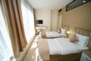 Voodi või voodid majutusasutuse B&M Hotel toas