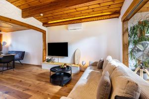 TV a/nebo společenská místnost v ubytování La Casa Holzwiesen