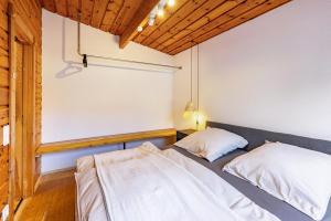 Postel nebo postele na pokoji v ubytování La Casa Holzwiesen