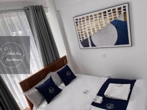 Postel nebo postele na pokoji v ubytování WhiteRose Apartments