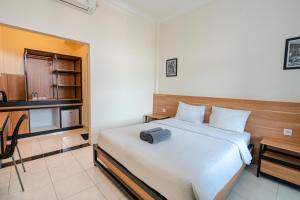 Postel nebo postele na pokoji v ubytování Pondok Anyar Hotel + 25 fotografií