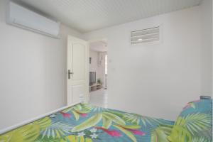Postel nebo postele na pokoji v ubytování Alpinia - Appt avec piscine partagée + 5 fotografií