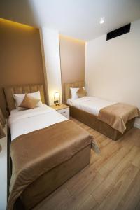 Voodi või voodid majutusasutuse B&M Hotel toas