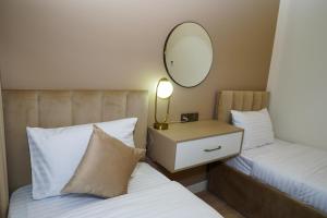 Voodi või voodid majutusasutuse B&M Hotel toas