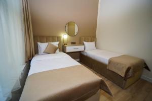 Voodi või voodid majutusasutuse B&M Hotel toas