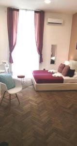 Letto o letti in una camera di DOMUS LUIGI LEONE 2