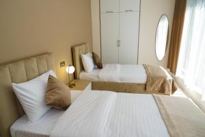 Voodi või voodid majutusasutuse B&M Hotel toas