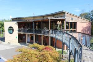 an old building with a staircase in front of it at Camping les Acacias in Altkirch