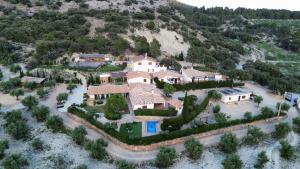 an aerial view of a house on a hill at ENTRESIERRAS Apartamentos rurales piscina 24h con barbacoa y espacio para eventos in Cazorla