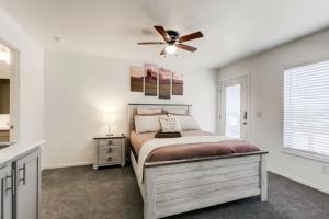 a bedroom with a bed and a ceiling fan at Cozy Mountain Town Farmhouse with Air Conditioning in Mountainaire