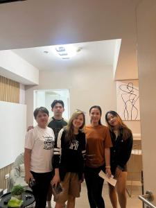 a group of people standing in a room at AZURE URBAN RESORT RESIDENCE R&C - Parañaque in Manila