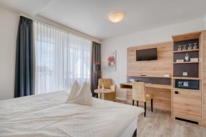 Postel nebo postele na pokoji v ubytování Hotel Wiehen-Therme
