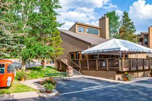 a house with a bench in front of it at Lodge at Steamboat A203 in Steamboat Springs