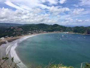 a view of a beach with boats in the water at Modern Studio/Apt overlooking Pool/Ocean view in San Juan del Sur
