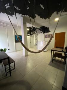 a hammock in a room with a tree on the ceiling at 1802 at San Juan in San Juan