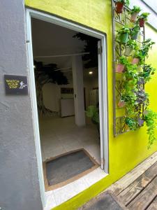 an open door of a building with potted plants at 1802 at San Juan in San Juan