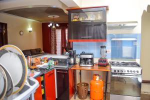 Kjøkken eller kjøkkenkrok på The Penthouse Suites Serviced Apartments Meru