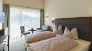 Postel nebo postele na pokoji v ubytování Hotel Niederreiter