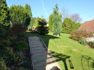 a garden with a set of stairs in the grass at Ferienwohnung Koenig in Wald-Michelbach