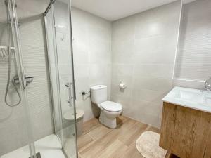 a bathroom with a toilet and a shower and a sink at Casa Mary R&R in Albolodúy +42 photos