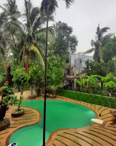 Het zwembad bij of vlak bij Amansaraa Bhide Retreat