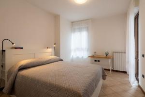 Postel nebo postele na pokoji v ubytování Mizar*B-Ampio Bilocale con parcheggio gratuito