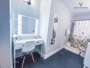 a bathroom with a white desk and a sink at The Moose #5 - Modern Comfy Studio with King Bed, Free Parking & Fast WiFi in Memphis