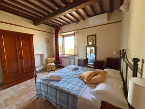 Posteľ alebo postele v izbe v ubytovaní Poggiosalto in Toscana
