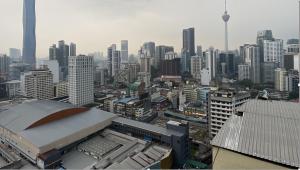 a view of a city with a lot of buildings at Fairlane Residence at Bukit Bintang in Kuala Lumpur
