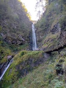 a waterfall on the side of a mountain at Ferienwohnung Rainer in Fieberbrunn
