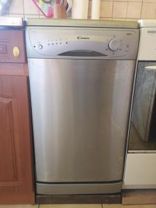 a stainless steel dishwasher in a kitchen at Natasa Apartman in Orosháza