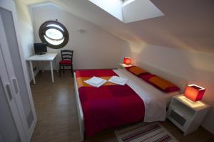 Ένα ή περισσότερα κρεβάτια σε δωμάτιο στο B&B La Terrazza di Frascati