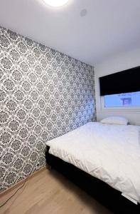 Postel nebo postele na pokoji v ubytování Modern Central City Apartment- Strandvegen 102b