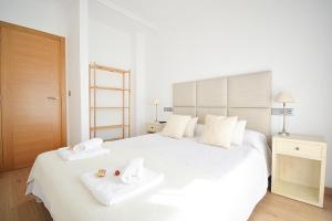 Säng eller sängar i ett rum på Apartamento Vila do Albariño