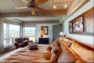 a large bedroom with a large bed and a balcony at Enclave 201, Snowmass Ski-In/Ski-Out Condo w/Shared Pool/Hot Tub/Gym/WiFi in Snowmass Village +24 photos