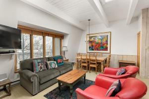 a living room with a couch and chairs and a table at Chateau Chaumont Unit 19, Spacious Top-Floor Condo with Great Location in Aspen