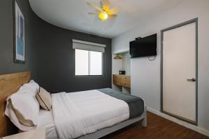 Cama ou camas em um quarto em TARATA BOUTIQUE HOTEL