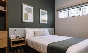 Cama ou camas em um quarto em TARATA BOUTIQUE HOTEL