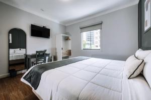Cama ou camas em um quarto em TARATA BOUTIQUE HOTEL