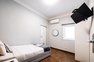 Cama ou camas em um quarto em TARATA BOUTIQUE HOTEL