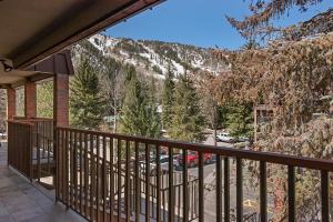 a balcony of a house with a view of a mountain at Silverglo Condominiums Unit 308, Expansive 4 BD Condo, Walking Distance to Town with Pool Access in Aspen