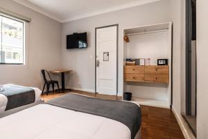 Cama ou camas em um quarto em TARATA BOUTIQUE HOTEL