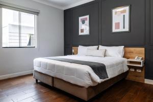 Cama ou camas em um quarto em TARATA BOUTIQUE HOTEL