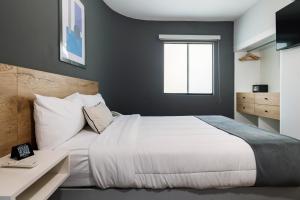 Cama ou camas em um quarto em TARATA BOUTIQUE HOTEL