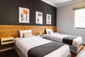 Cama ou camas em um quarto em TARATA BOUTIQUE HOTEL
